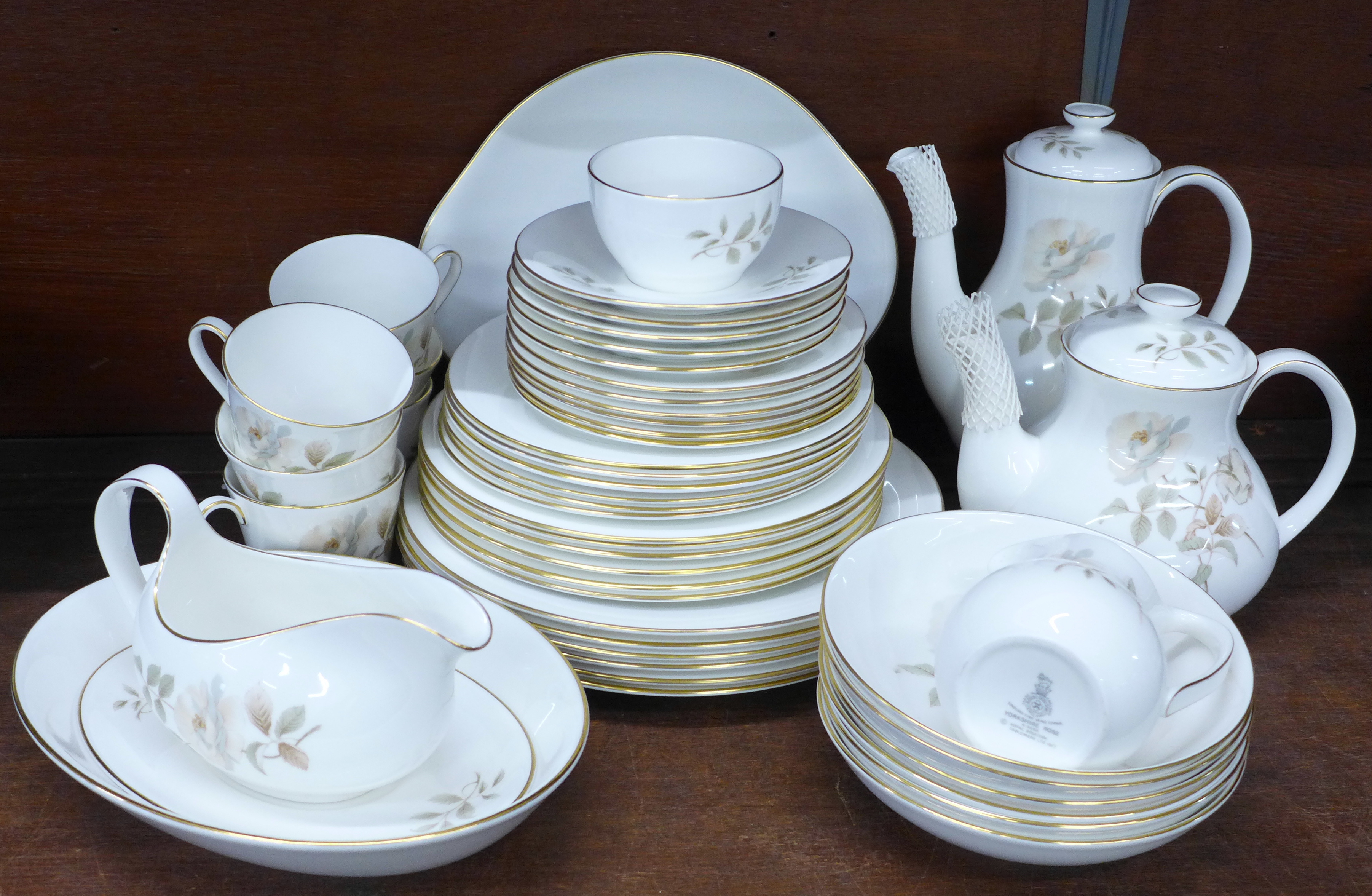 A Royal Doulton Yorkshire Rose tea set and dinner service, six setting with tea and coffee pot (