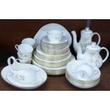 A Royal Doulton Yorkshire Rose tea set and dinner service, six setting with tea and coffee pot (