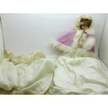 A 19th Century doll with wax head and limbs with bonnet