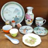 A collection of Chinese and Japanese ceramics including a vase, small plates, mugs and a larger