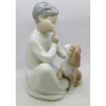 A Lladro figures, boy with dog, 19.5cm