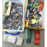 A box of die-cast model vehicles, playworn and lead figures