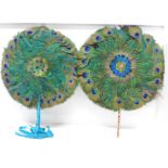 A pair of peacock feather fans