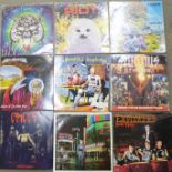 A collection of rock and metal LP records including Motorhead, Riot, The Exploited, Thrash