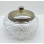 A large silver topped glass jar, the lid marked sterling silver and weighs 72g, diameter of glass