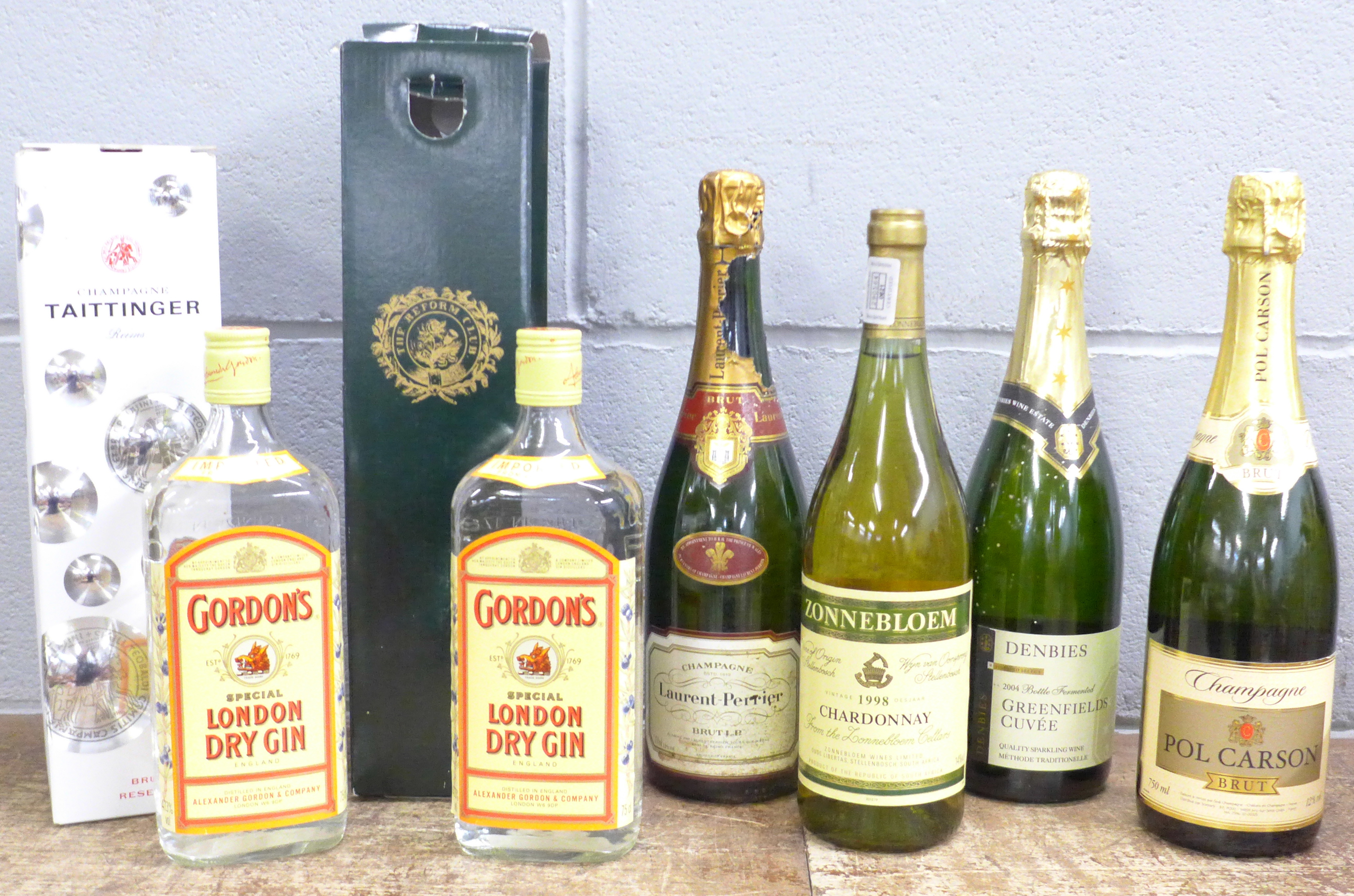 A collection of champagnes including Taittinger, Laurent-Perrier, two bottles of wine including 1998