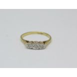 An 18ct gold, platinum set three stone diamond ring, 1.9g, M