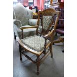 A Victorian Aesthetic Movement inlaid walnut elbow chair