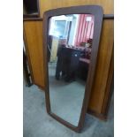 A teak framed mirror