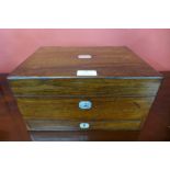 A Victorian rosewood and mother of pearl inlaid lady's travelling vanity box