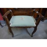 A 19th Century French walnut and upholstered cabriole leg stool