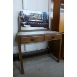 An Art Deco walnut two drawer dressing table, manner of Heals, London