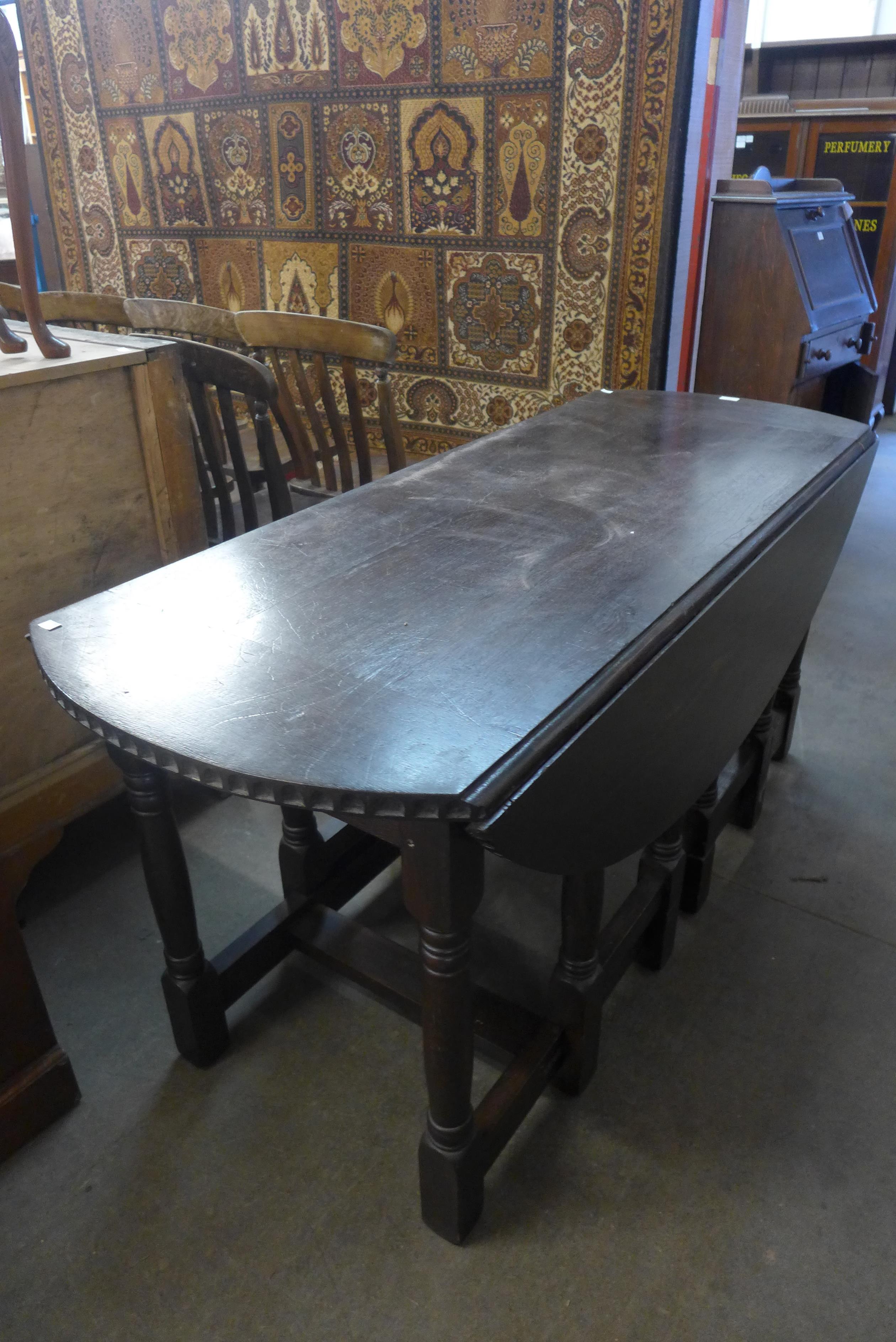 An oak double gateleg table