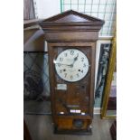 An oak wall hanging clocking in machine, Time Recorders (Leeds Ltd.)