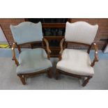 A pair of walnut and upholstered open armchairs