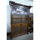 A Victorian Gothic Revival carved oak bookcase, manner of A.W.N. Pugin