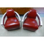 A pair of riveted aluminium and red leather aviator chairs