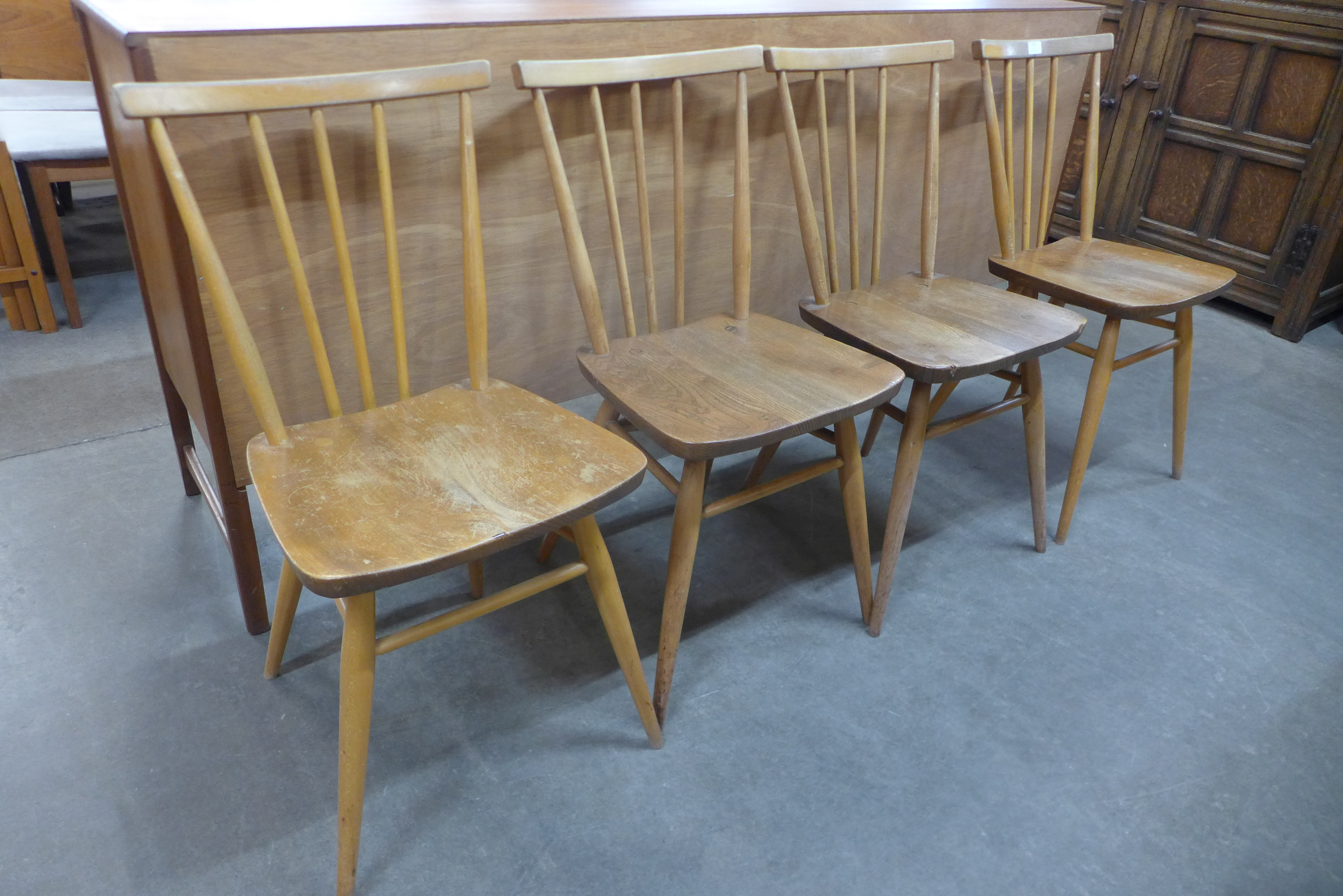 A set of four Ercol Blonde elm and beech 391 model chairs