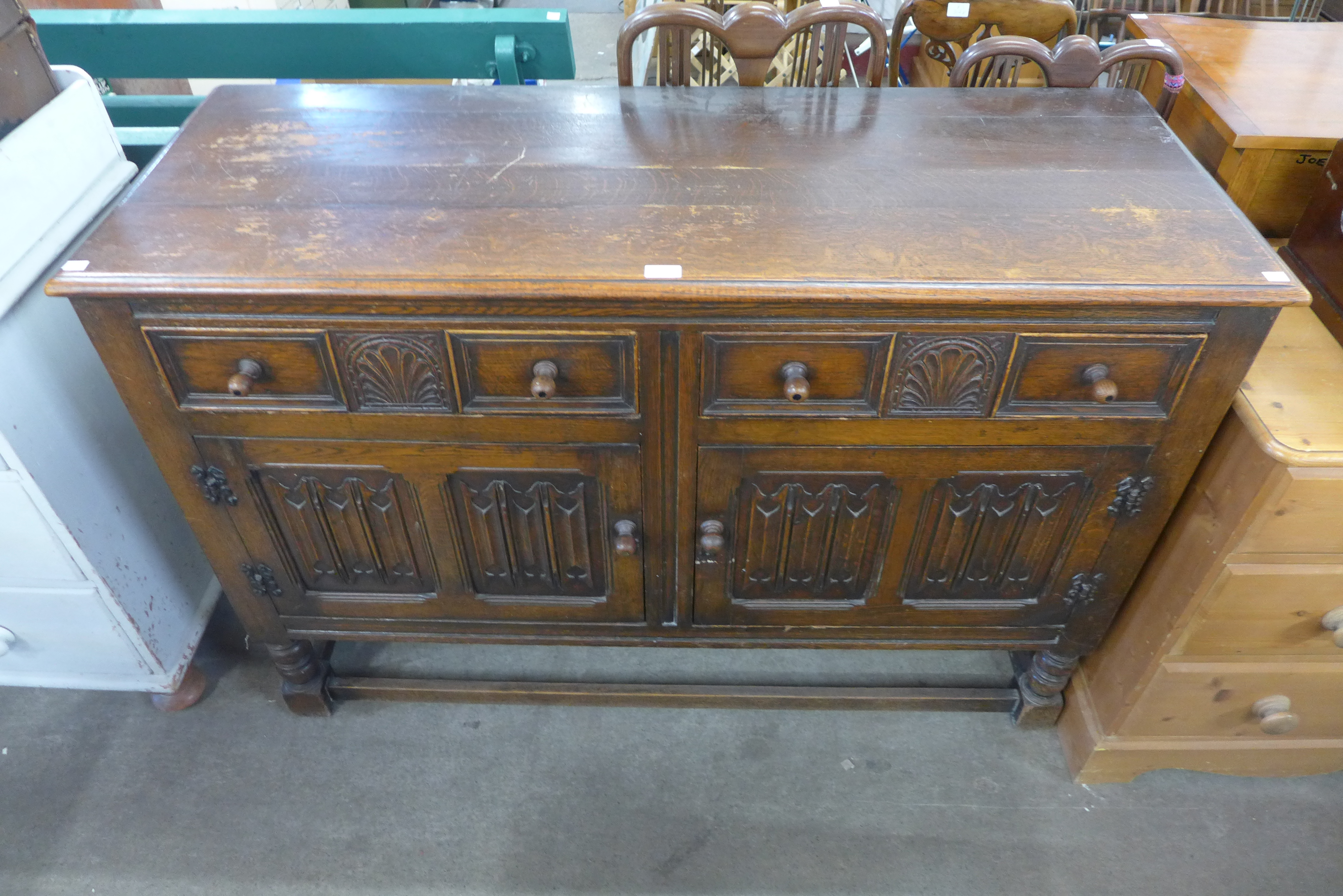 An oak linenfold panel sideboard