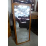 A teak framed mirror