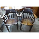 A pair of early 20th Century oak office desk chairs