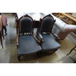 A pair of Victorian ladies and gentleman walnut and upholstered armchairs