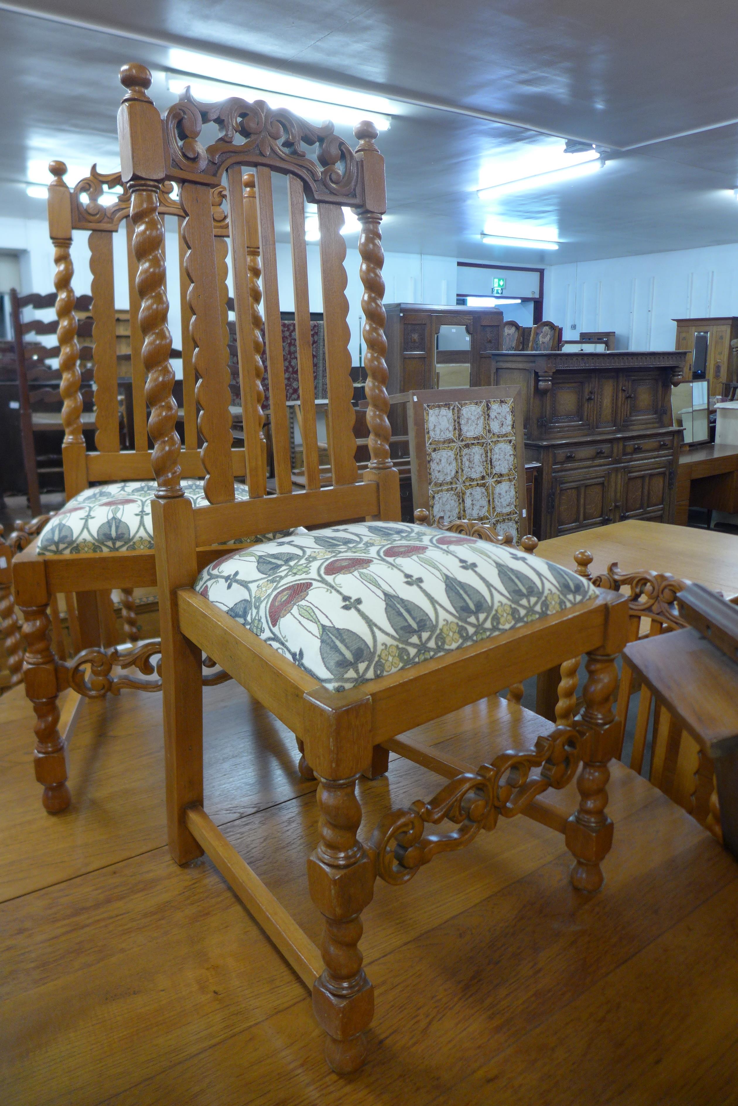 A carved oak barleytwist ten piece dining suite, comprising extending table, eight chairs and buffet - Image 2 of 3