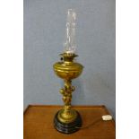 An early 20th Century brass cherub oil lamp