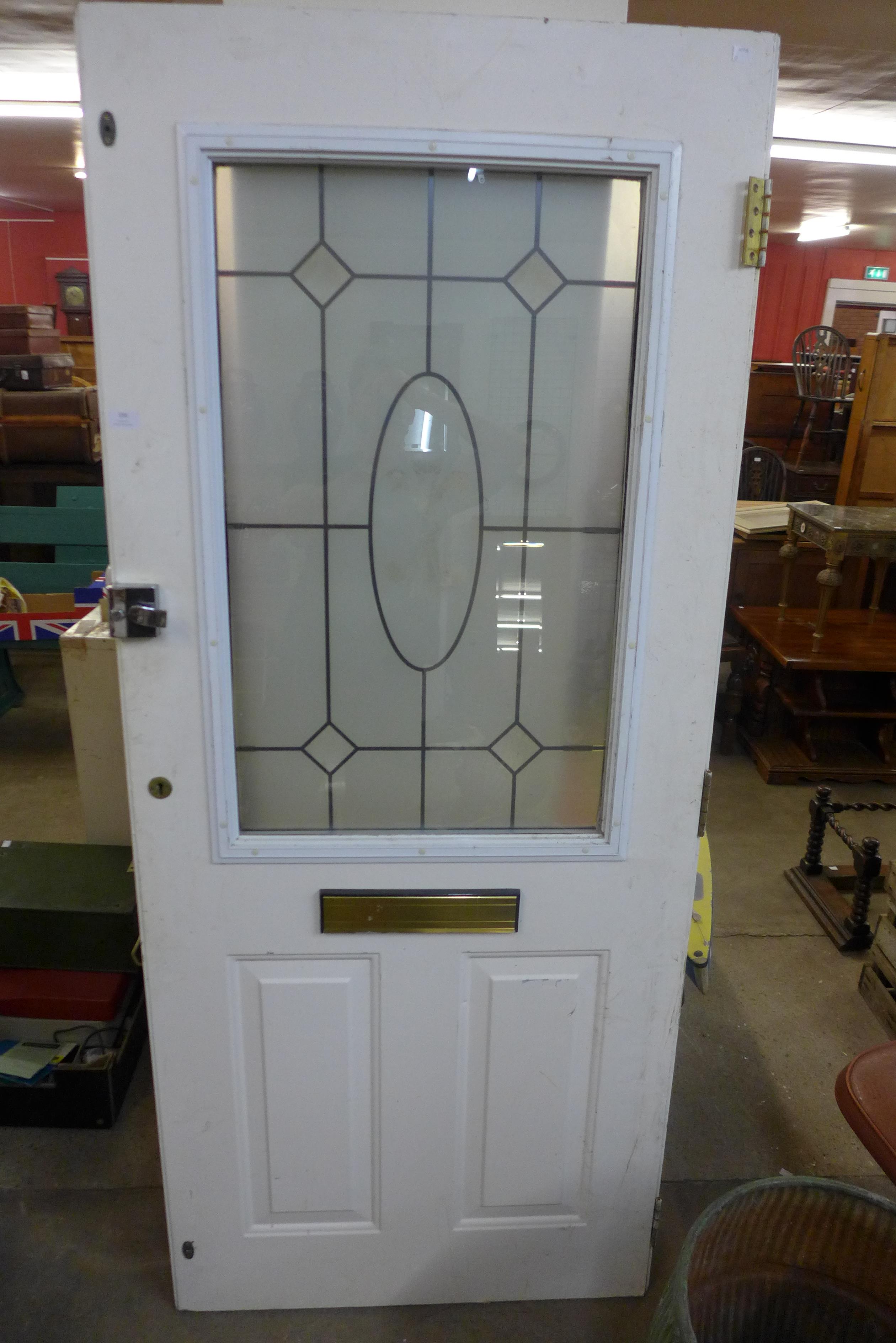 A pine and etched glass door