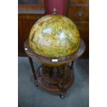 A terrestrial globe cocktail cabinet