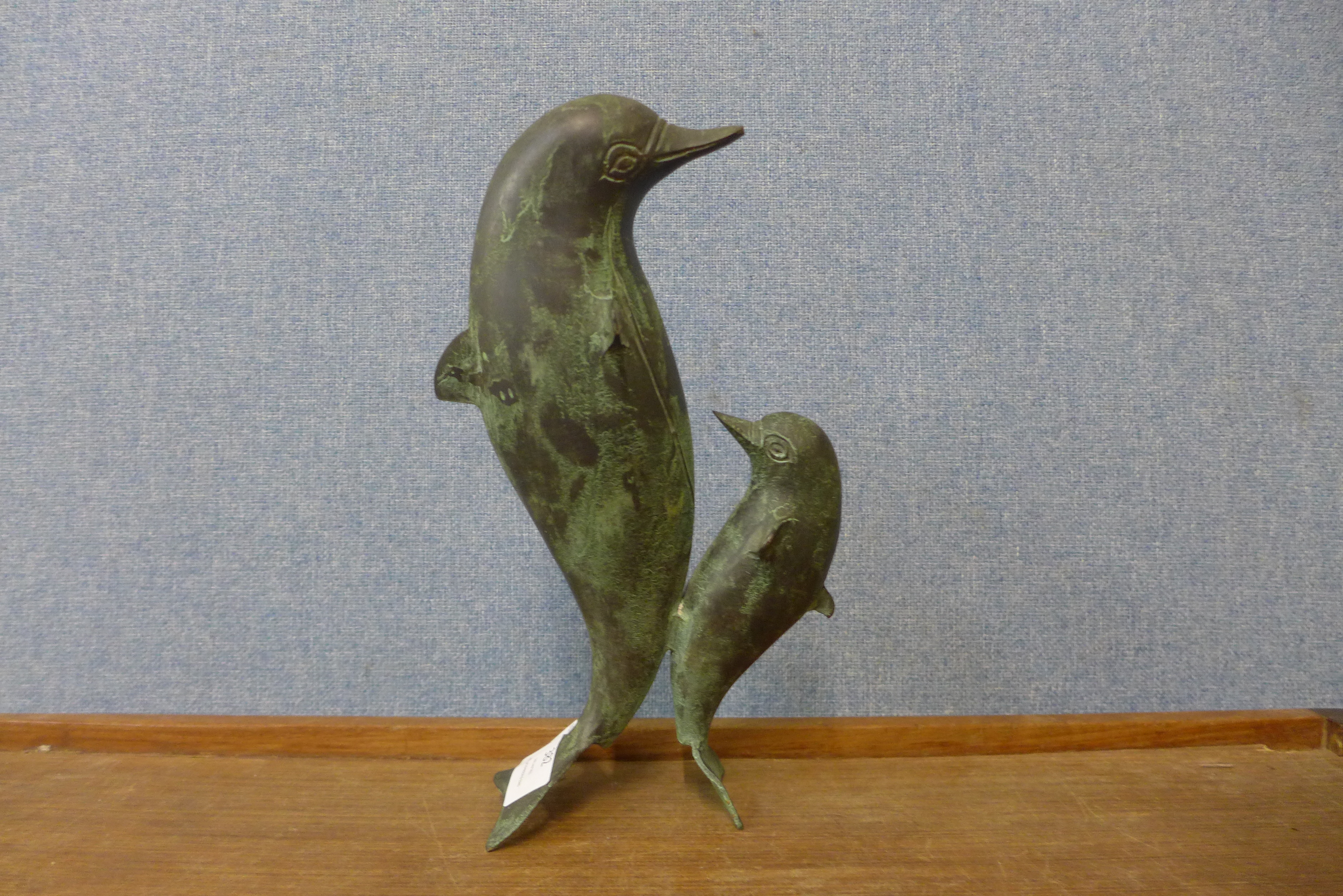 A bronze figure of Dolphins