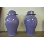 A pair of Oriental purple porcelain ginger jars and covers