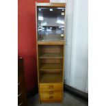 A teak display cabinet