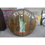 A wooden barrel lid marked, Liberty Straight Bourbon Whisky