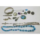 A collection of vintage jewellery including a foil bead necklace, silver butterfly wing brooch, a