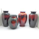 A pair of Poole vases, 21cm and two other Poole vases