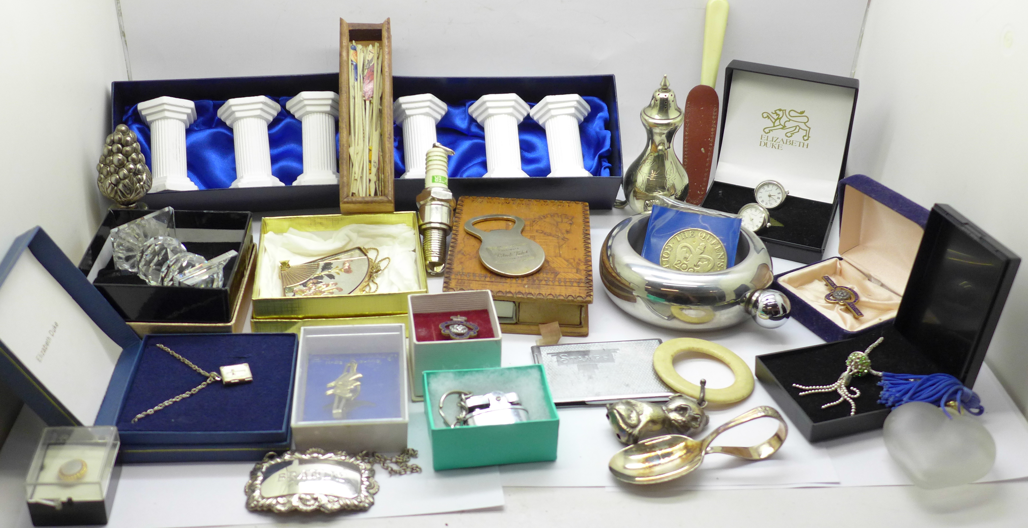 A collection of tie-pins, silver plated items, Swarovski, lighters, cufflinks, a rattle, match