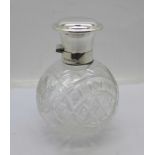A modern hallmarked silver topped globular glass scent bottle