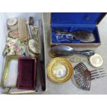 A pair of tortoiseshell rimmed spectacles, brush and mirror set, hair comb, etc.