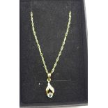 An aquamarine and diamond pendant and chain, marked 9ct, 1.2g