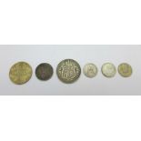 Six coins; a 1909 half crown, an 1887 florin, a 1897 shilling and three sixpences, 1900, 1925 and