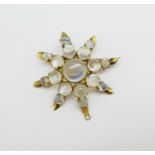 A Victorian yellow metal and moonstone pendant/brooch, boxed, 33mm