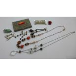 A collection of Art Deco jewellery including necklaces, earrings, brooch, etc., and a gem set box