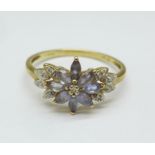 A 9ct gold, diamond and purple stone ring, 2.4g, T