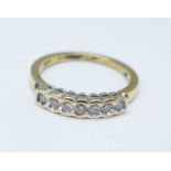 A 9ct gold seven stone diamond ring, 2.6g, N