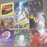 A collection of LP records and 12" singles including The Rolling Stones, The Beatles, The Kinks,