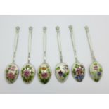 Six hallmarked silver and enamel coffee spoons, each bowl back with different floral designs, 58g