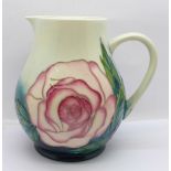 A Moorcroft Rose jug, for members of the Moorcroft Collectors Club, designed by Sally Tuffin, 14.5cm