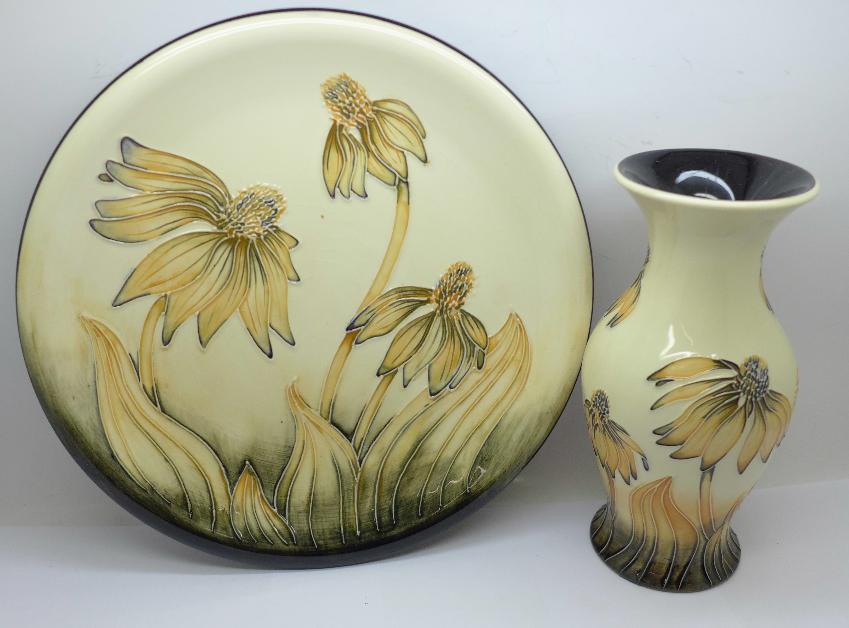 A Moorcroft Cone Flower plate, 26cm (crazed to centre) and vase, 19.5cm