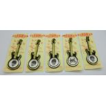 A set of five Invicta Plastics The Fabulous Beatles guitar brooches